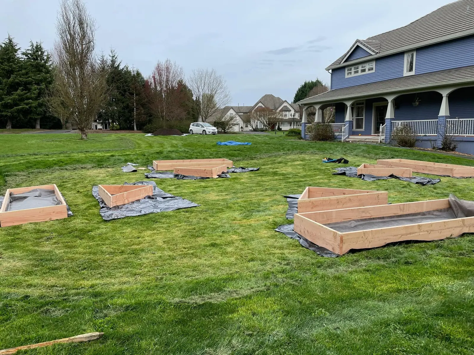 Cedar raised garden beds being framed on a Clark County backyard lawn