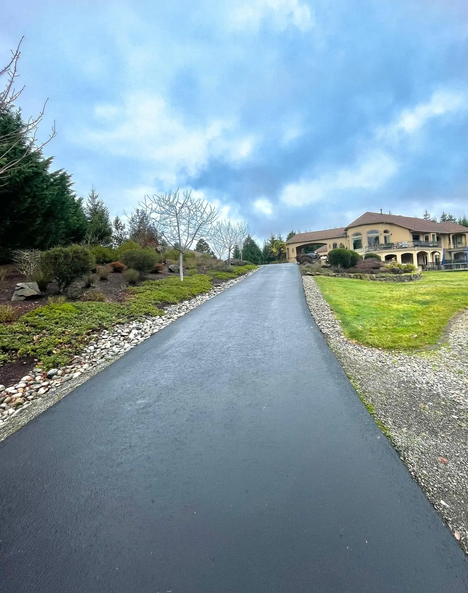 Long paved driveway finished through a rural Clark County property