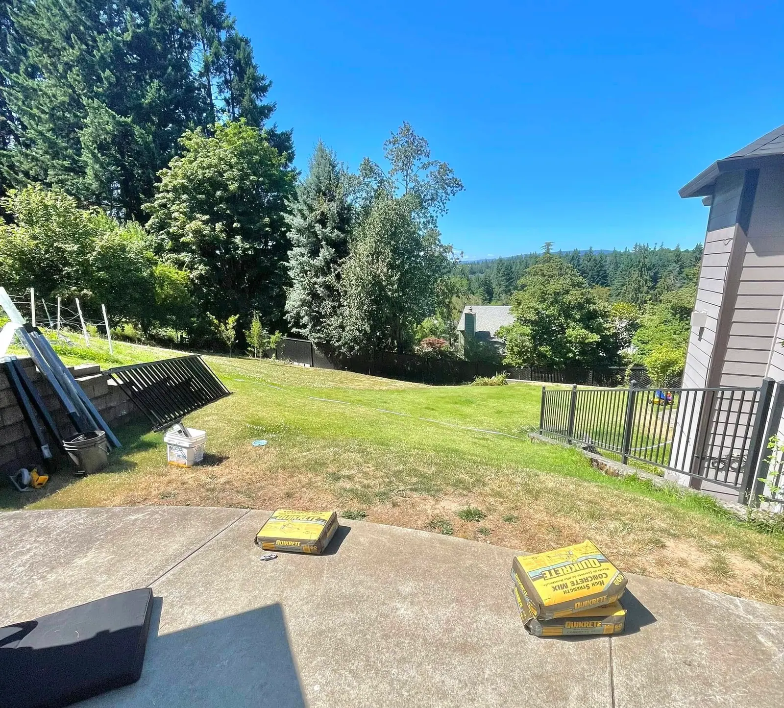 Pallets of sod staged on site before a lawn installation