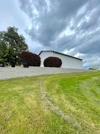 Rolling lawn and shaped shrubs on a rural Clark County property